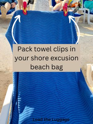 Towel clips on a beach chair holding a cruise line towel