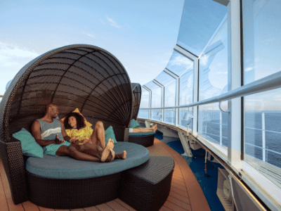Cuddle in a 2 person lounger in the Serenity adult only area on Carnival Cruise ships.  this is just one of 21 romantic things to do on a Carnival cruise ship.