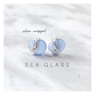 Beautiful light blue sea glass earrings wrapped in silver