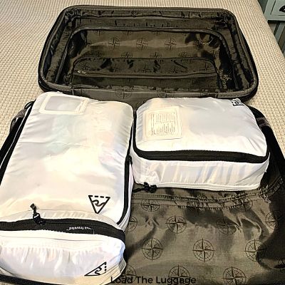 Suitcase packed using compression packing cubes