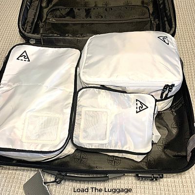 Suitcase packed using regular packing cubes